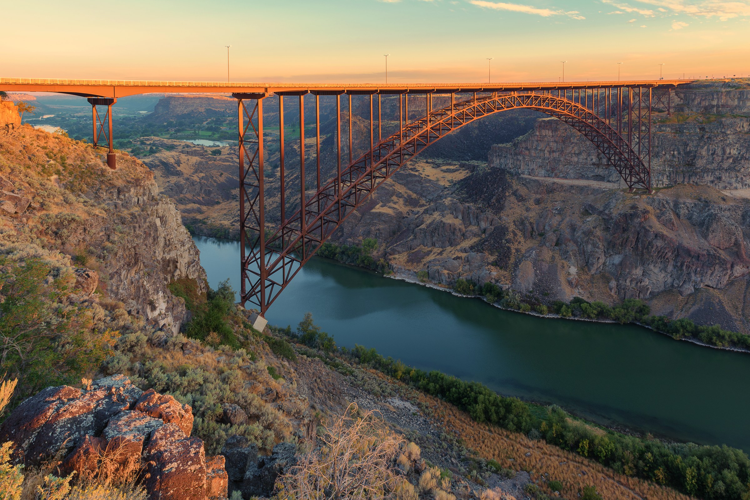 Sunrise painting golden colors on Perrine Bridge, Twin Falls, Idaho